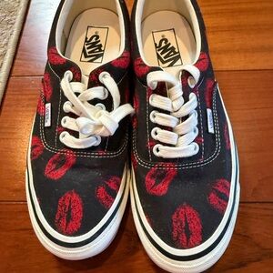 This is a pair of Vans Era 95 DX Anaheim Factory OG Black Hot Lips sneakers